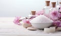 Spa decoration with stones, candle, pink flower and a bottle with massage oil. Royalty Free Stock Photo