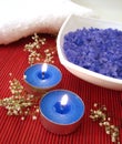 Spa essentials (blue salt, towels, candle and flower) Royalty Free Stock Photo