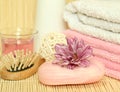 Spa essentials. Towels, soap, flowers. Royalty Free Stock Photo