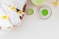 Rolled towels, candles and frangipani flowers. Royalty Free Stock Photo