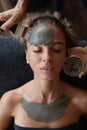 Spa Face Mask. Beauty Treatment For Skin Care. Beautician Applying Mud On Female Face. Relaxed Model On Cosmetic Procedure.