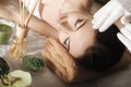 Spa. Face massage. Spa skin and body care. Close-up of young woman getting spa massage treatment at beauty spa salon. Facial beau Royalty Free Stock Photo