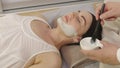 Spa Facial Mask Application.Cosmetologist applying mask