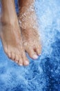 Spa - Female leg massage with aerated blue water