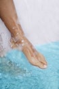 Spa - Female leg massage with aerated blue water