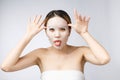 Spa, healthcare. Asian girl with a cosmetic mask isolate on white. Royalty Free Stock Photo