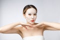 Spa, healthcare. Asian girl with a cosmetic mask isolate on white. Royalty Free Stock Photo