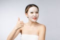 Spa, healthcare. Asian girl with a cosmetic mask with showing thumb up. Royalty Free Stock Photo