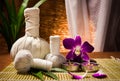 Spa herbal compressing ball with candles and orchid Royalty Free Stock Photo