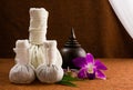 Spa herbal compressing ball with wooden casket and orchid. Royalty Free Stock Photo