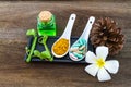 Spa herbal white frangipani flowers, turmeric powder in white spoon ,pill,Cissus Quadrangularis Linn,pine,Aloe vera essential oil Royalty Free Stock Photo