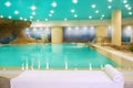 Spa indoor turquoise water white towel Royalty Free Stock Photo