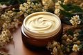 A spa inspired composition showcasing a white cosmetic jar and herbal flowers, representing beauty, skincare, and natural