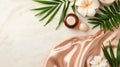 Spa items with flowers and palm leaves on a marble surface Royalty Free Stock Photo