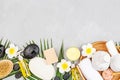 Spa massage Aromatherapy body care background. Spa herbal balls, cosmetics, towel and tropical leaves on gray concrete Royalty Free Stock Photo