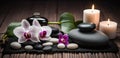 Spa Massage basalt stones with candles, lotus flowers, orchid flower and towels on bamboo mat. Generative AI Royalty Free Stock Photo