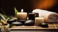 Spa Massage basalt stones with candles, lotus flowers, orchid flower and towels on bamboo mat. Generative AI Royalty Free Stock Photo