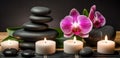 Spa Massage basalt stones with candles, lotus flowers, orchid flower and towels on bamboo mat. Generative AI Royalty Free Stock Photo