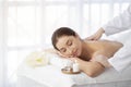 Spa Massage. Indian Woman Relaxing On Table While Therapist Massaging Her Shoulders Royalty Free Stock Photo