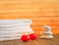 Spa massage border background with towel stacked stone and red candles warm atmosphere Royalty Free Stock Photo