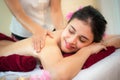 Spa Massage.  Masseur doing massage with treatment sugar scrub on Asian woman body in the Thai spa lifestyle Royalty Free Stock Photo