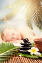 Spa massage outdoor. Beautiful young woman getting spa massageÃÅ½ Focus on Spa objects Royalty Free Stock Photo
