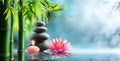 Spa - Natural Alternative Therapy With Massage Stones And Waterlily Royalty Free Stock Photo
