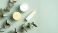 SPA natural herbal cosmetics set on green background top view. Royalty Free Stock Photo