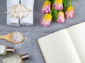 Spa with natural olive soap, tulips and sea salt and an open notebook for writing Royalty Free Stock Photo