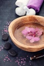 Spa with orchid flowers, zen stones and herbal massage balls Royalty Free Stock Photo