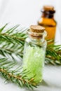 spa with organic spruce oil and sea salt in glass bottles on whi Royalty Free Stock Photo