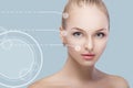 Spa portrait of young and natural woman with dotted arrows on face on blue background. Medicine and skin care Royalty Free Stock Photo