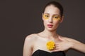 Spa portrait of a young woman. Flowers on her face. The concept of skin and body care. Perfect skin health Royalty Free Stock Photo