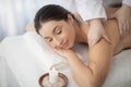 Spa Procedure. Beautiful Indian Woman Getting Body Massage In Wellness Center Royalty Free Stock Photo