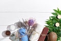 Spa products. Bath salts, dry flowers lavender, soap, candles and towel. Flat lay on white wooden background, top view. Royalty Free Stock Photo