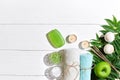 Spa products. Bath salts, soap, candles and towel. Flat lay on white wooden background, top view. Royalty Free Stock Photo