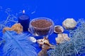 New Year card with candles and sea shells and salt on a blue background. Cosmetic treatment concept