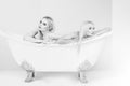 Spa and relaxation, pretty girls in white bath Royalty Free Stock Photo