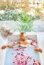 Spa Relaxation. Woman Body Care. Flower Bath. Beauty Skincare Royalty Free Stock Photo