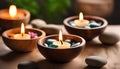 Spa resort concept - Close up of floating aromatherapy candles in wooden bowls Royalty Free Stock Photo