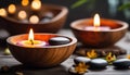 Spa resort concept - Close up of floating aromatherapy candles in wooden bowls Royalty Free Stock Photo