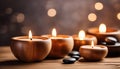 Spa resort concept - Close up of floating aromatherapy candles in wooden bowls Royalty Free Stock Photo