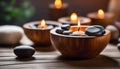 Spa resort concept - Close up of floating aromatherapy candles in wooden bowls Royalty Free Stock Photo