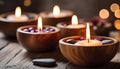 Spa resort concept - Close up of floating aromatherapy candles in wooden bowls Royalty Free Stock Photo