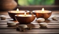 Spa resort concept - Close up of floating aromatherapy candles in wooden bowls Royalty Free Stock Photo