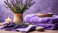 Spa resort concept - Close up of lilac with towels, candles and stones