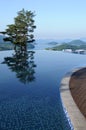 Spa resort hotel infinity swimming pool, healthy lifestyle summer vacation vertical