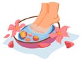 Soaking feet in bowl with aromatic water spa salon