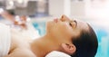 Spa, salon and woman relax at pool for massage, facial treatment and luxury pamper. Aesthetic, dermatology and person Royalty Free Stock Photo