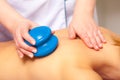 Spa salon. Woman relaxing having cupping-glass massage. Bodycare.